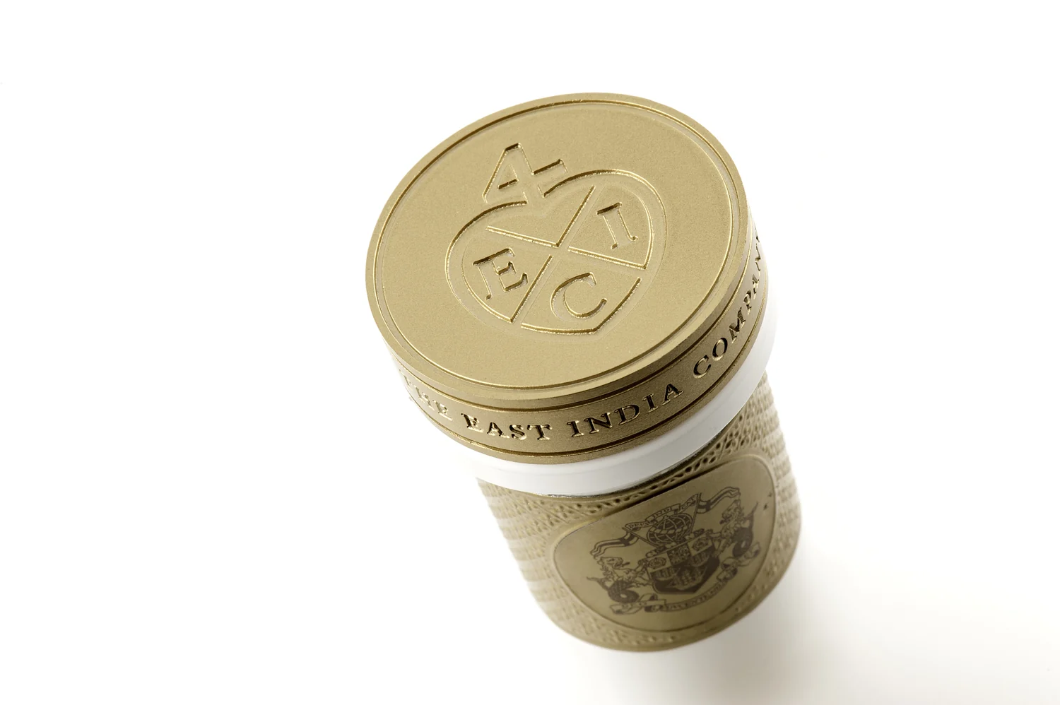 Intricately engraved gold coin closure